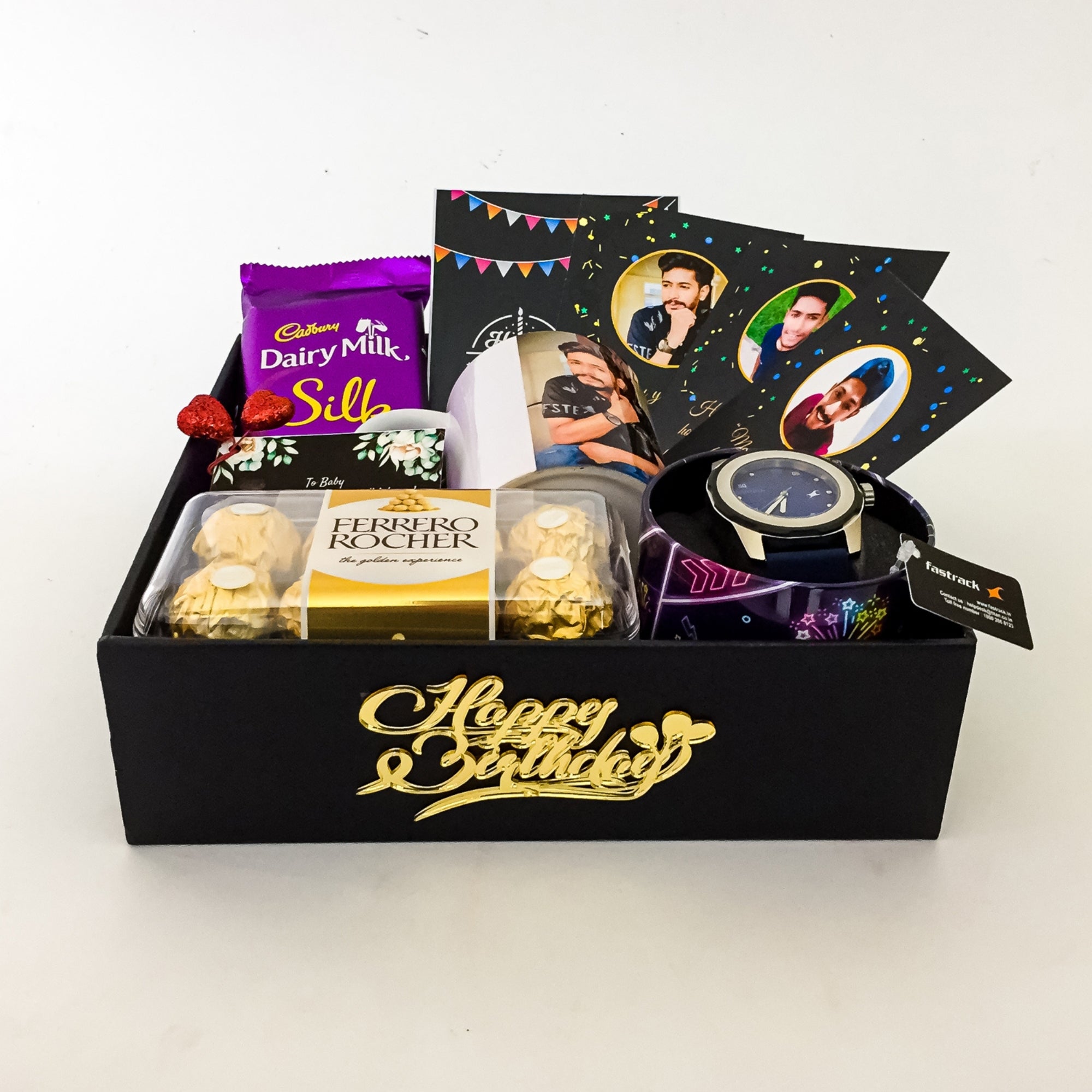 Gift box with chocolates, a watch, and photo cards